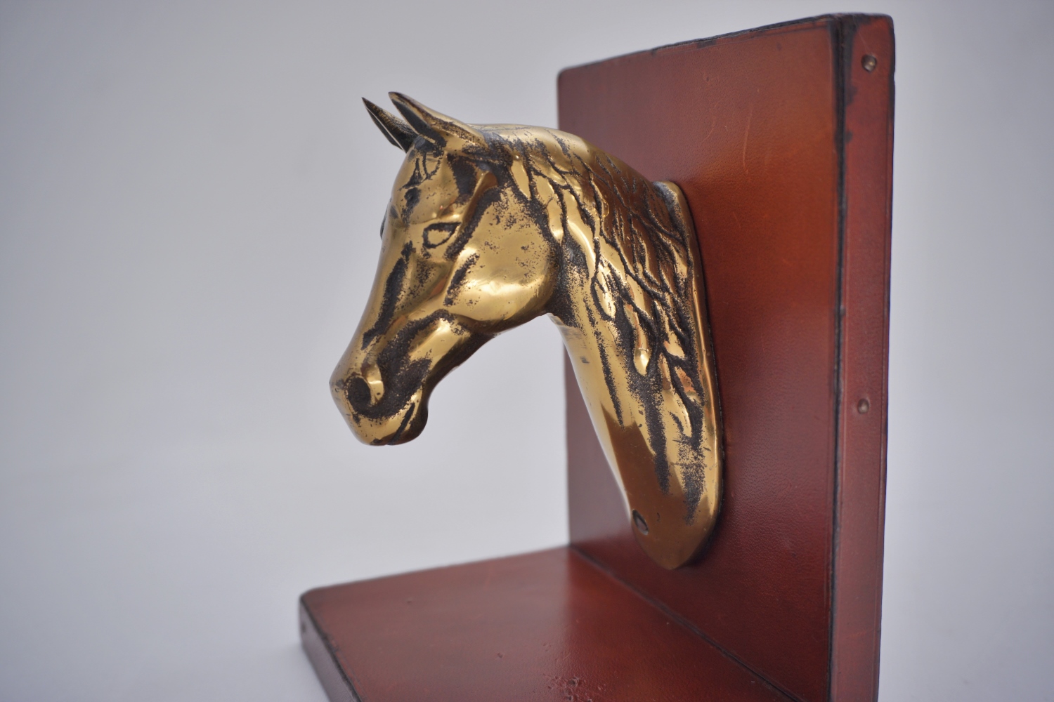 Vintage horse bookends, Maison Charles style, brass & leather